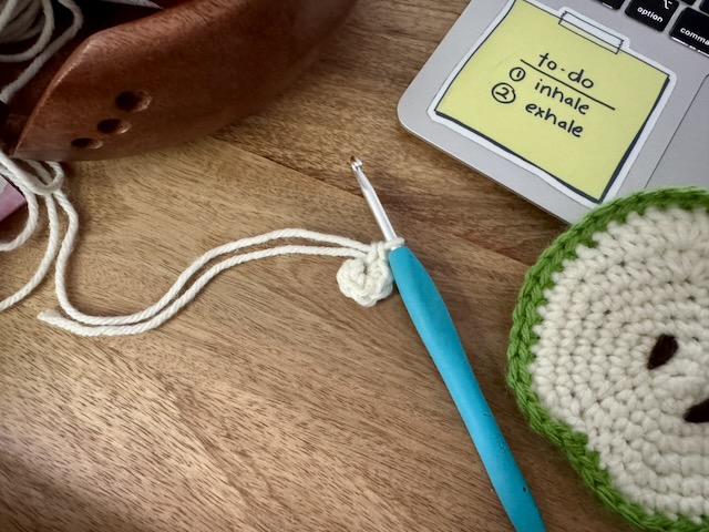 cream colored yarn crocheted into a 6 stitch magic ring